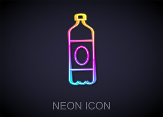 Glowing neon line Plastic beer bottle icon isolated on black background. Vector.
