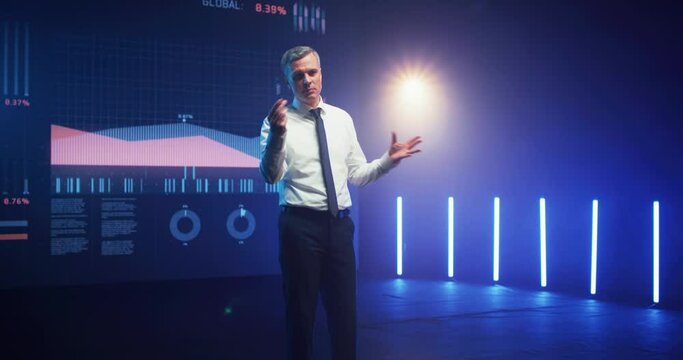 Mature financial consultant speaking from stage