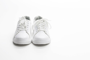 Pair of White Sneakers Over White Background.
