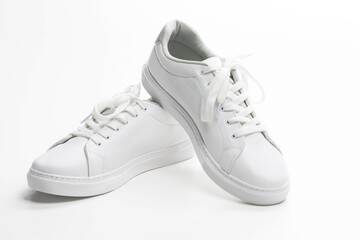 Pair of New White Sneakers Over White Background.