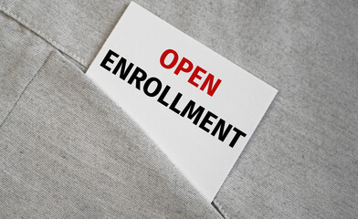 Top view of sticker in a pocket with OPEN ENROLLMENT text.