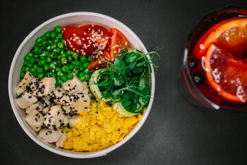 Bowl with chicken on gray table tea