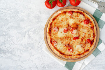 Top view of pizza Margherita on gray surface