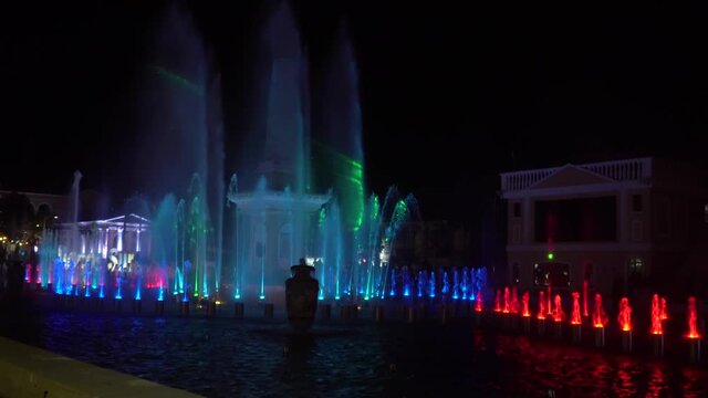 November 14, 2019-Vigan, Philippines: Music show of dancing fountains with colorful illumination at night with reflection.