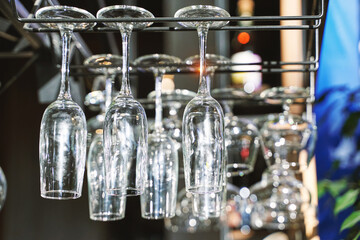 Wine glasses upside down. Clean cafe drink cup. Empty bar. Bistro backdrop. Resaturant space. Customer bistro