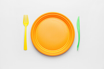 Plastic tableware on white background