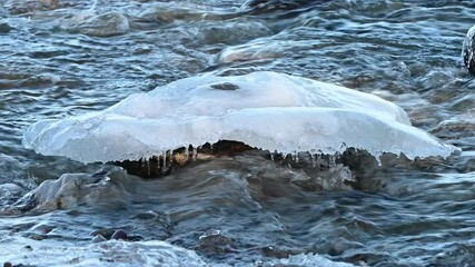 River with slow flowing water ends in ocean - Powered by Adobe