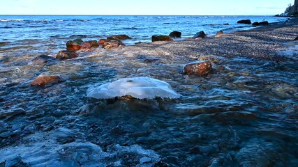 River with slow flowing water ends in ocean - Powered by Adobe