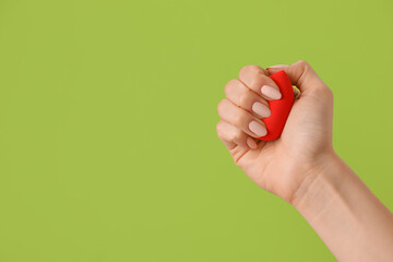 Hand with makeup sponge on color background