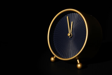 Alarm clock on black background