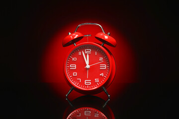 Alarm clock on black background