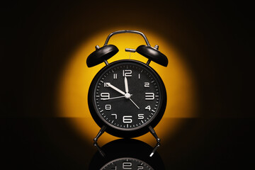 Alarm clock on black background