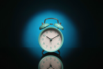 Alarm clock on black background