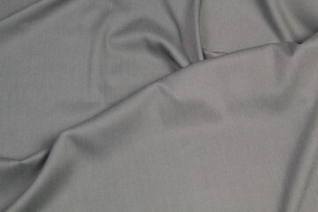 Fabric jeans fold top view. Gray textile 