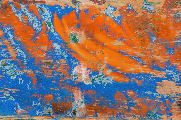 Polished and abraded paint on an old wooden wall of a boat.