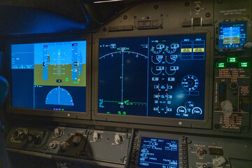 displays and cockpit layout of a modern passenger jet airplane 
