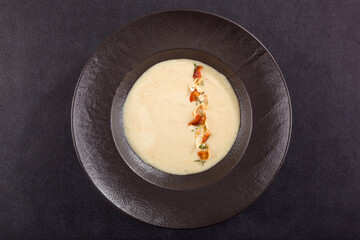 Cream soup on dark background.