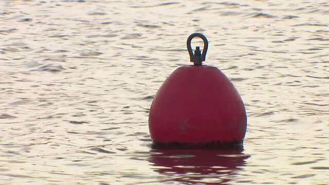 Buoy on the water. Bathing is prohibited, do not swim behind the buoy.