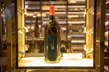 large wine bottle in a shining display case