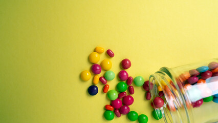 colorful little candies on a colored background