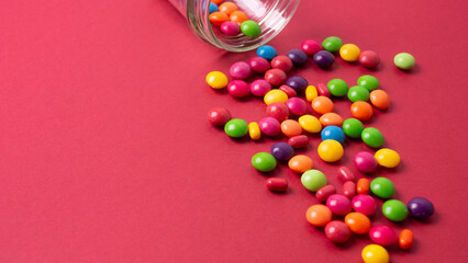 Obraz premium colorful little candies on a colored background