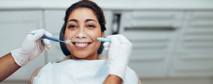 Young woman having dental checkup at the dentist