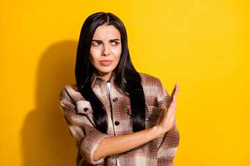 Photo of young woman unhappy upset show no stop sign decline refuse prohibition isolated over yellow color background