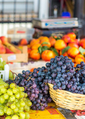 Large bunches of succulent green and black grapes at Kotor market,Montenegro,Eastern Europe.
