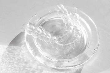 Invisible transparent aligners plastic braces dentistry retainers on glass