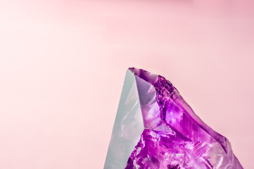 Amethyst crystals isolated pink colorful background