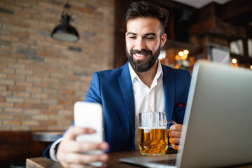 Young business man having a break in a restaurant. Work occupation business lifestyle concept