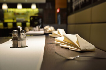 Catering and vase of flowers on the table in restaurant.