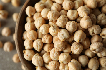 Wooden bowl with fresh chickpea, close up