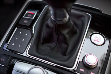 Modern luxury interior engine start stop button shift gear of manual gearbox and Multi Media...
