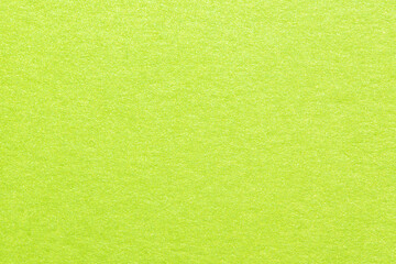 Obraz na płótnie Canvas Texture of green shiny metallic paper