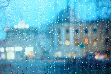 wet window city lights rain drops, abstract background autumn winter glow glass