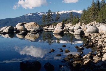  mirror reflection in the lake of the mountains in spring at Lake Tahoe, CA