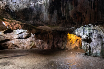 A scenic cave with white and yellow lights