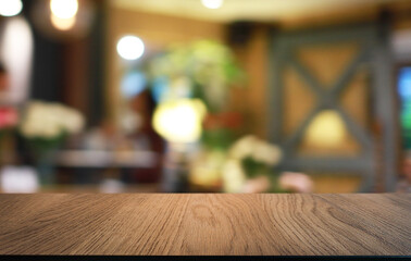 Empty wooden table in front of abstract blurred background of coffee shop . can be used for display or montage your products.Mock up for display of product