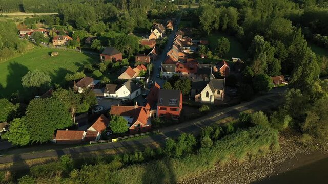 Aerial view of Vlassenbroek, a picturesque village on the shore of Scheldt river, in East Flanders