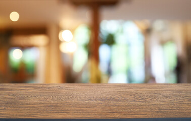 Empty wooden table in front of abstract blurred background of coffee shop . can be used for display or montage your products.Mock up for display of product
