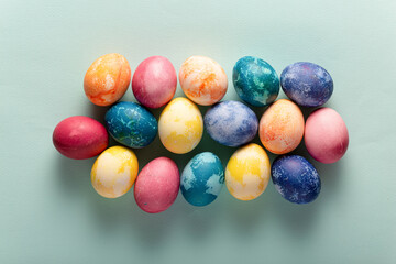 Fototapeta na wymiar Easter eggs on blue background, top view