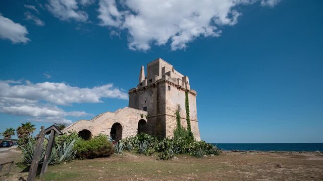 Time lapse of historical fortification tower Torre Colimena on Salento Ionian sea coast, Taranto, Puglia, Italy