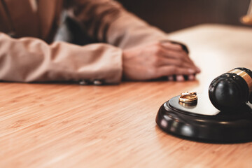 Judge gavel deciding on marriage divorce signing papers. lawyer concept.