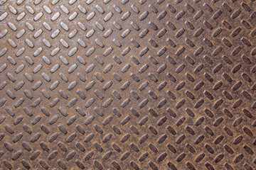 The texture of corrugated sheet metal painted in red.