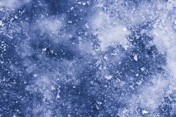 Obraz premium Beautiful texture of frozen ice with snow in winter close-up for background and wallpaper