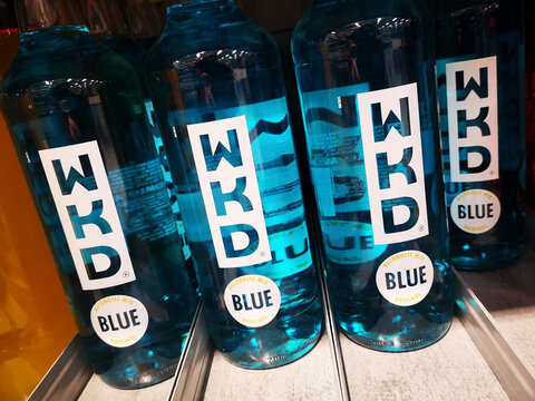 London, UK - February 15, 2021: WKD blue original alcoholic mix drink packaging on a supermarket shelf. WKD is a brand of alcopop produced by Beverage Brands.