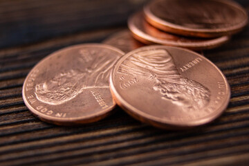 Copper coins close-up on a wooden table.