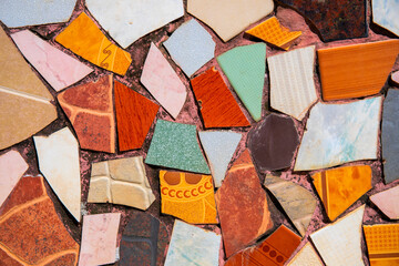 Colorful ceramic mosaic floor. Creative recycled mosaic top view photo. Bathroom or kitchen floor design idea.