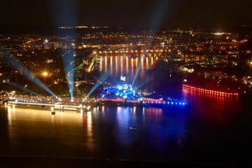 Deutsches Eck in Koblenz lit with celebratory lights where Mosel and Rhine meet